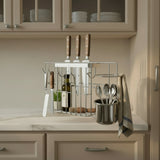 Wall-mounted kitchen organizer with knives, bottles, and utensils on a tiled wall without mounting pipe.